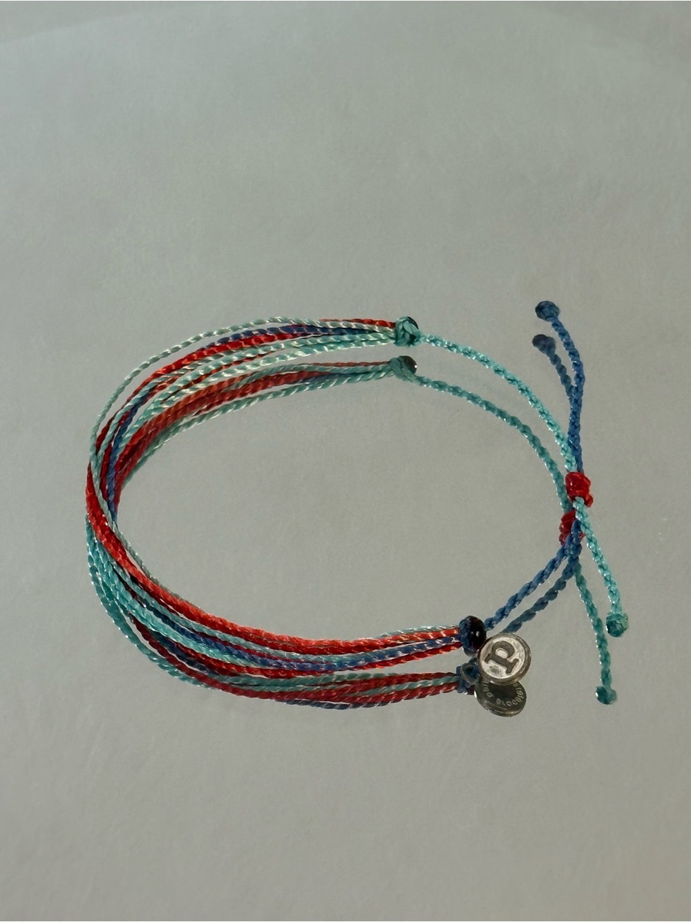 Pura Vida Red, Teal & Blue Multistrand Braided Bracelet with Silver Charm